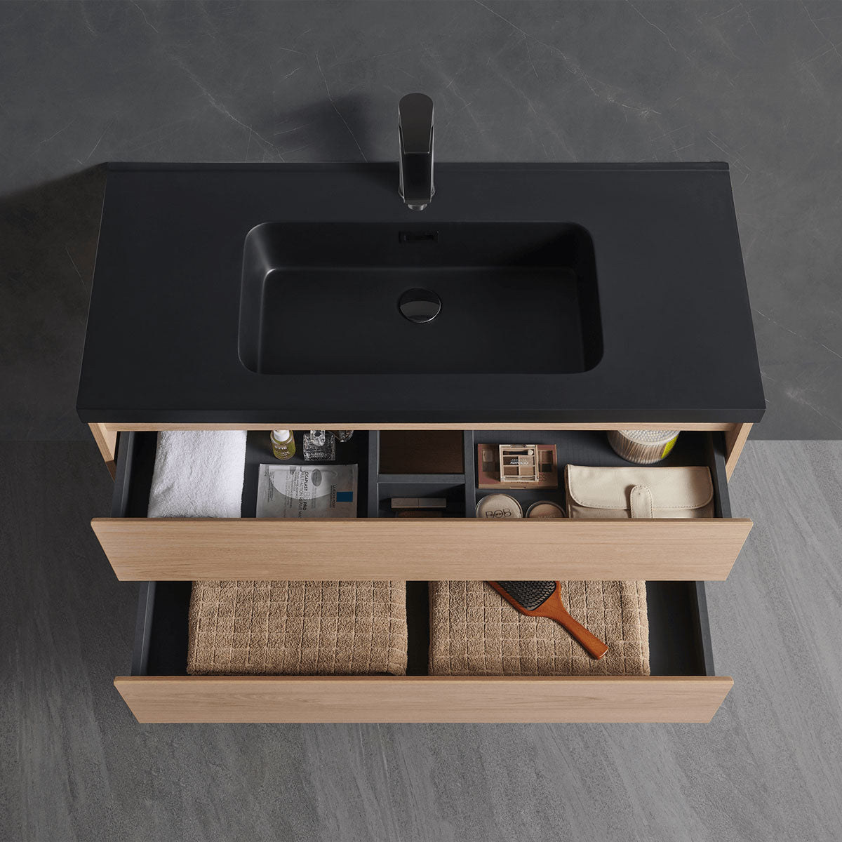 Open drawer detail of matte black top floating single sink bathroom vanity, spacious woven storage compartments