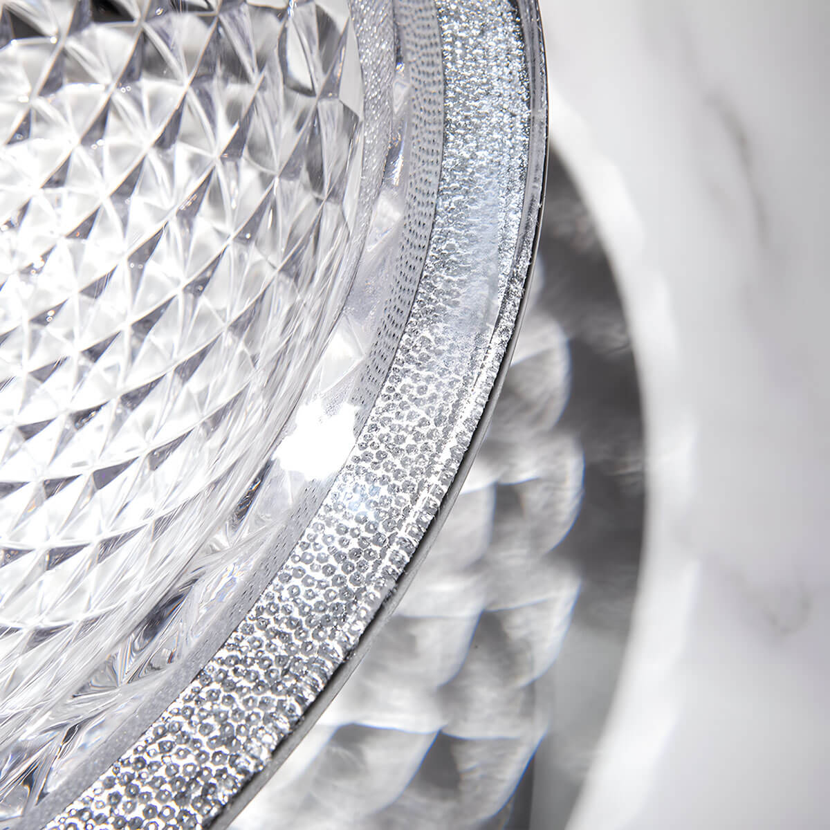 Close-up interior shot of dense diamond embossed texture on clear round tempered glass sink surface