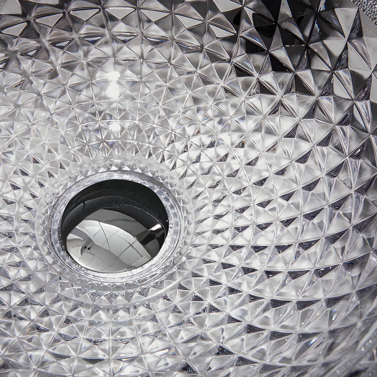 Close-up interior shot of dense diamond embossed texture on clear round tempered glass sink surface