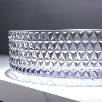 Close-up shot of diamond textured surface on clear round tempered glass bathroom vessel sink, crystal embossed craft detail