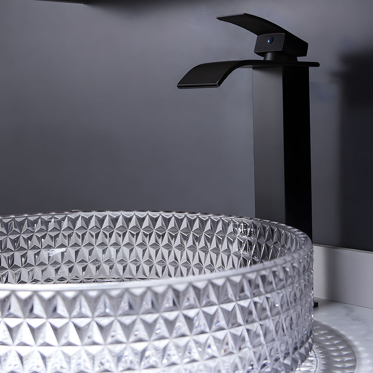 Round clear diamond embossed tempered glass vessel sink, transparent textured wash basin on white marble vanity with matte black faucet
