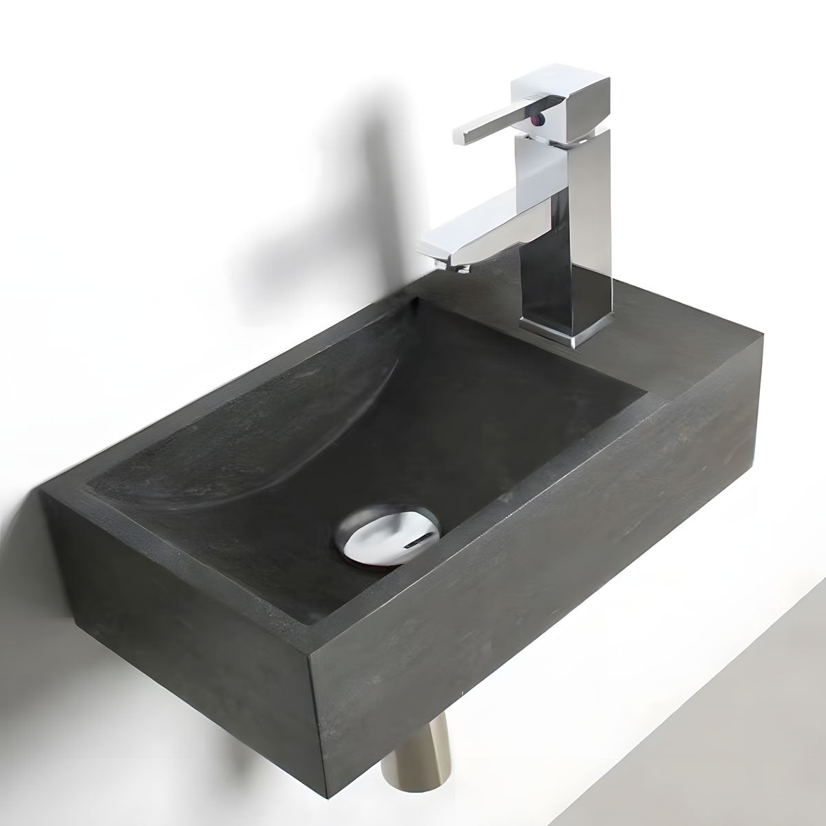Small rectangular integrated wall mounted black natural stone wash basin with matte stone texture